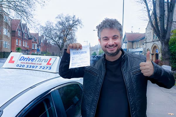 DriveThruL student celebrating pass day in East London